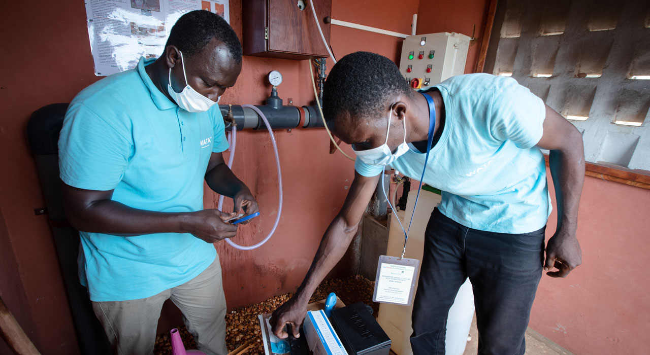 WATA technicians inspecting a water treatment installation in Benin.
