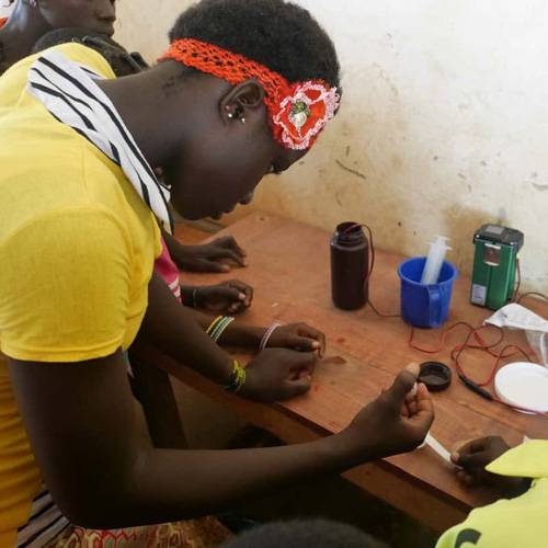 burkinabese girl learning to make drinkable water with WATA device